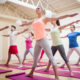 Group of people performing stretching exercise